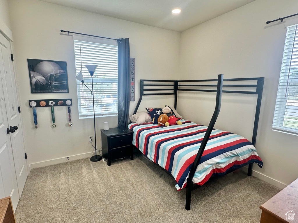 Bedroom with carpet, baseboards, and recessed lighting