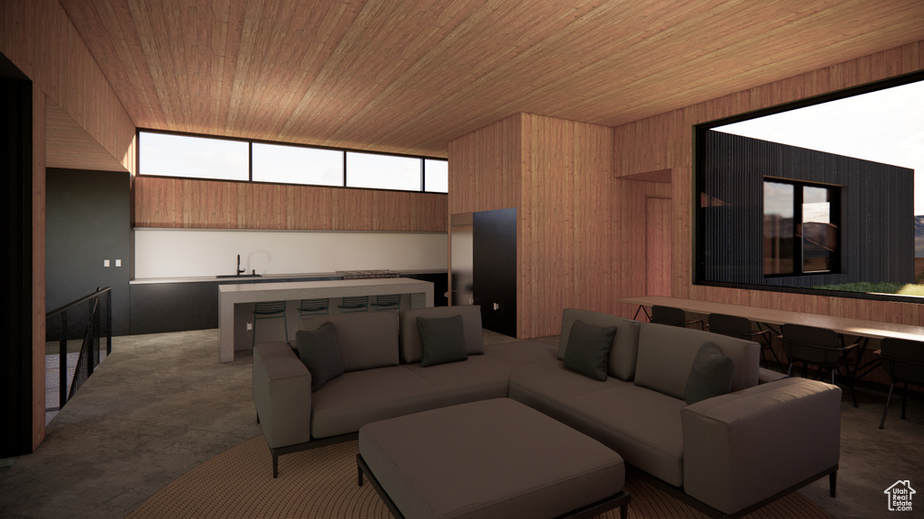 Home theater room with wood ceiling and wood walls