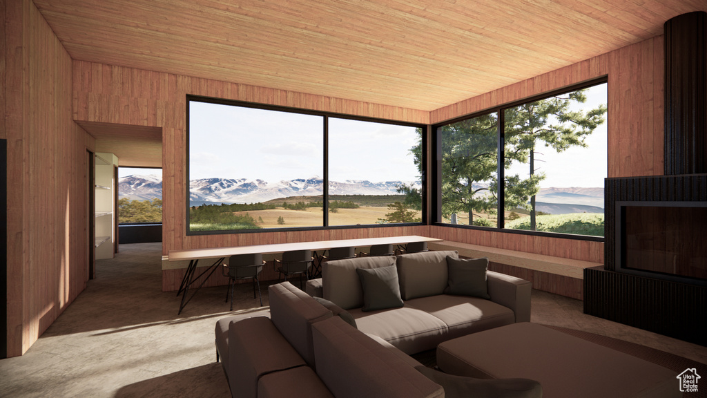 Sunroom with a mountain view
