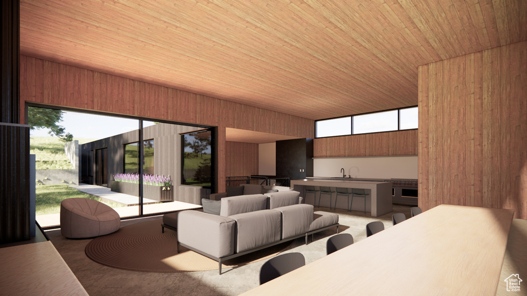 Living room featuring wooden ceiling, wooden walls, and healthy amount of natural light