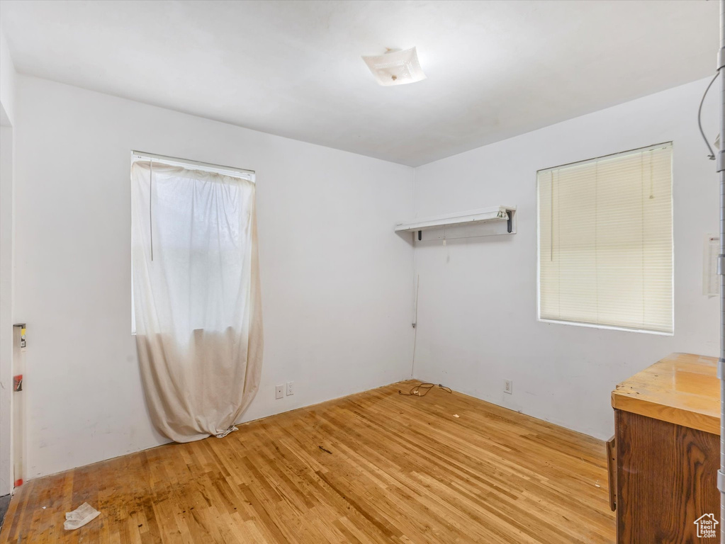Spare room with wood finished floors