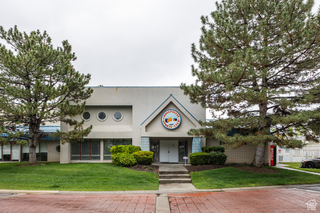 View of front of house featuring stucco siding