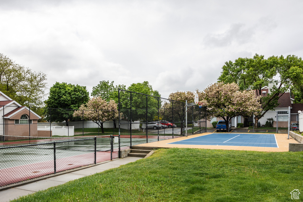 View of sport court featuring a tennis court