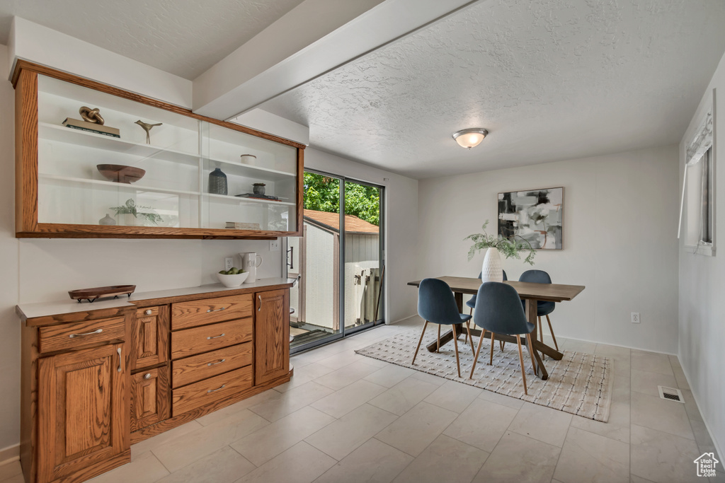 Dining space with a textured ceiling