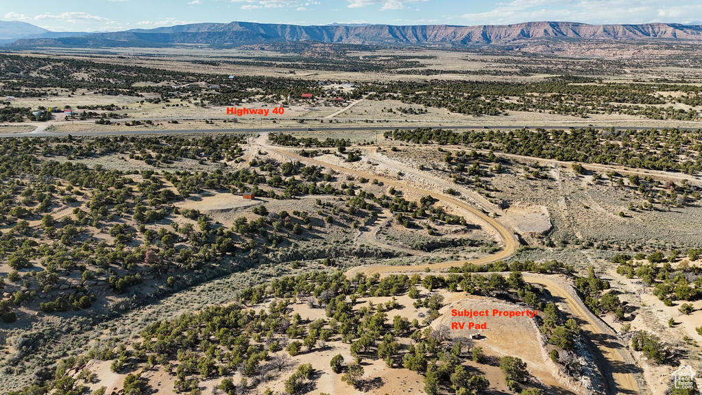 Overview of rural landscape featuring mountains and a desert landscape