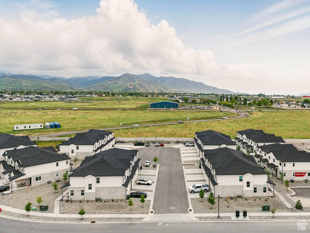 Aerial view of residential area featuring a mountainous background