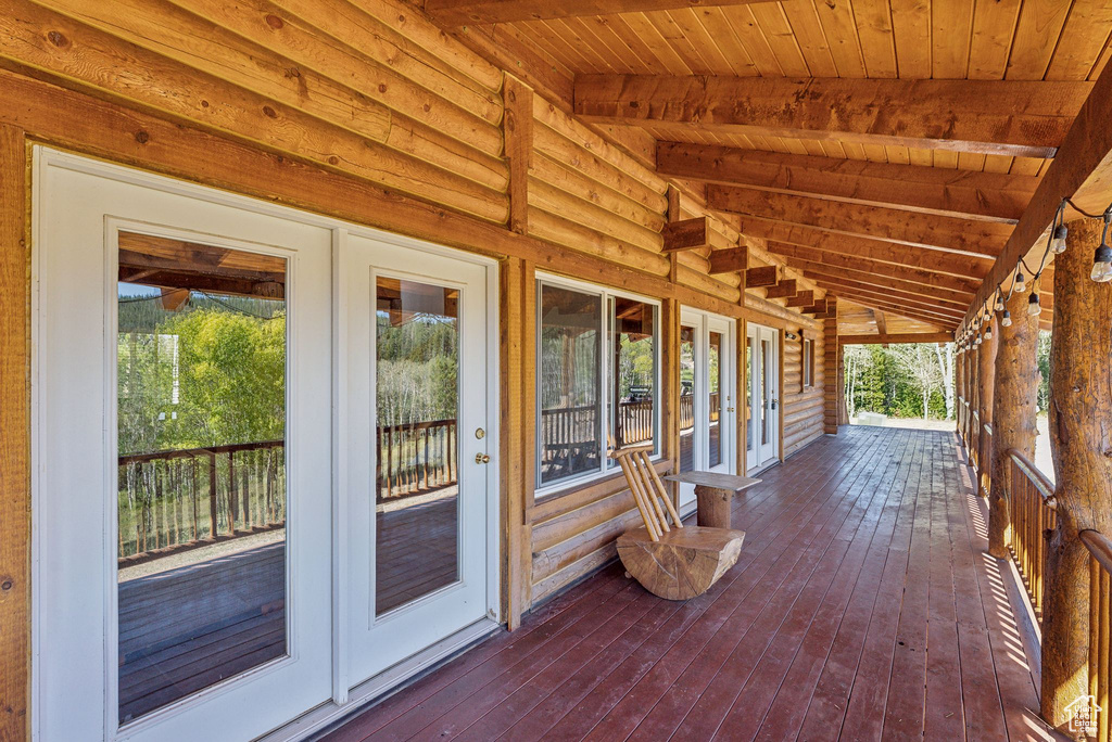 Wooden deck featuring french doors