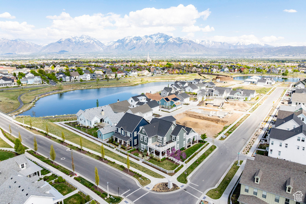 Aerial perspective of suburban area with a water and mountain view