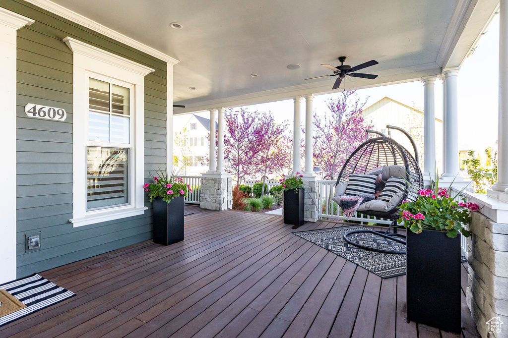 Deck featuring a porch and a ceiling fan
