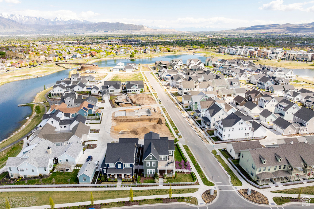 Aerial perspective of suburban area featuring a water and mountain view