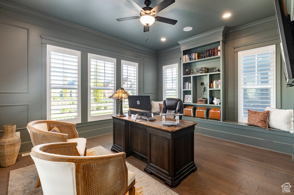 Office with ceiling fan, ornamental molding, wood finished floors, recessed lighting, and a decorative wall