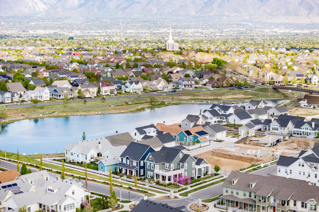 Aerial perspective of suburban area with a large body of water