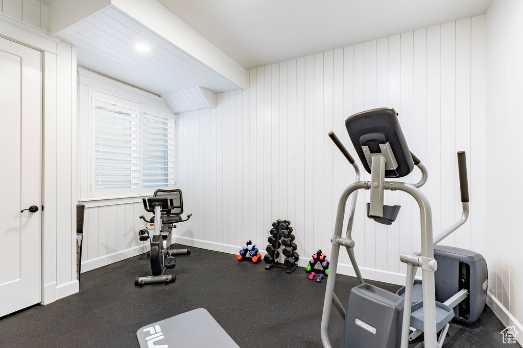Workout area featuring baseboards