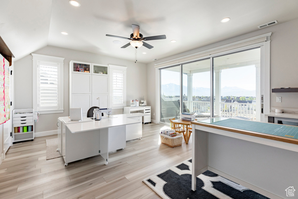 Home office with a ceiling fan, light wood-style floors, recessed lighting, baseboards, and vaulted ceiling