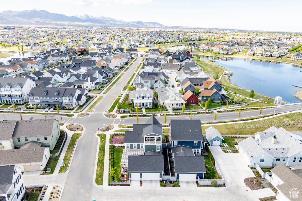 Aerial perspective of suburban area with a water and mountain view