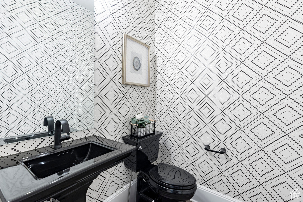 Bathroom featuring a sink and toilet