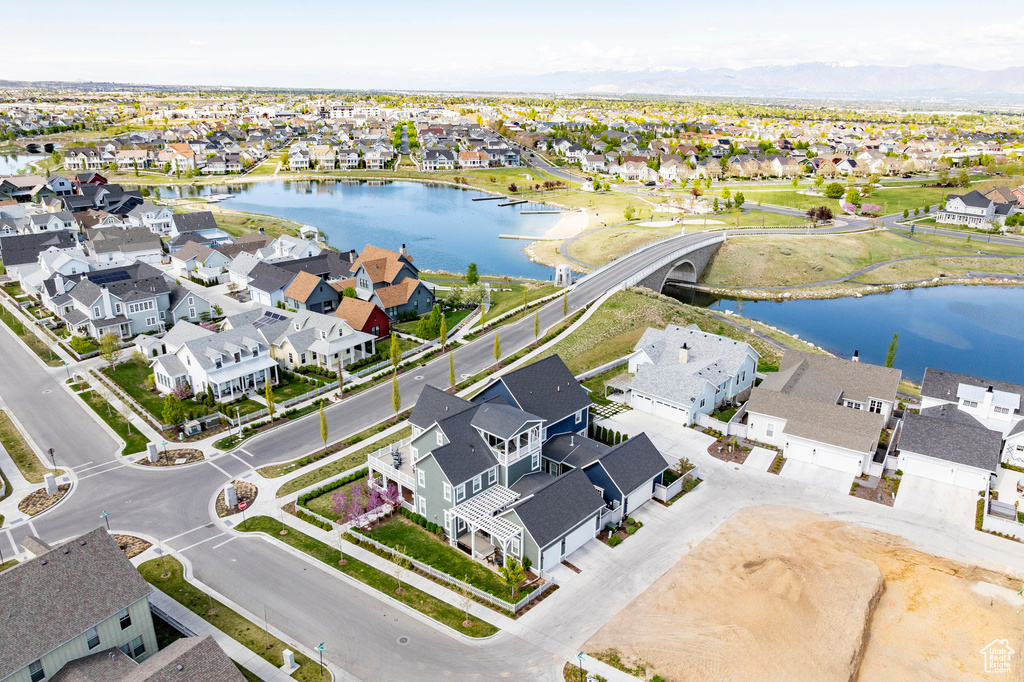 Aerial view of residential area featuring a large body of water