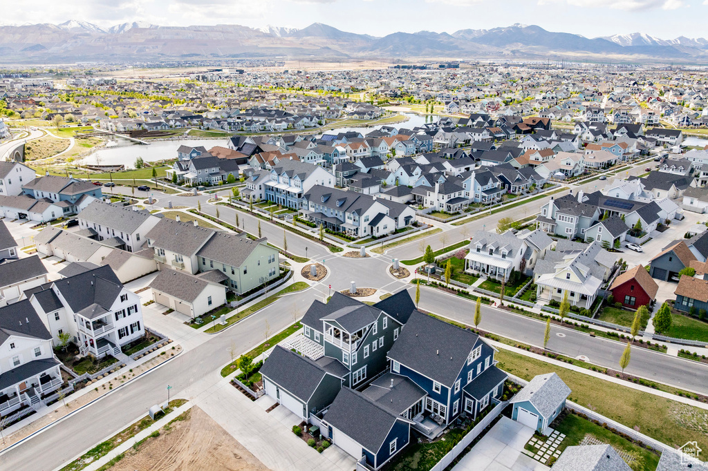 Aerial perspective of suburban area featuring a water and mountain view