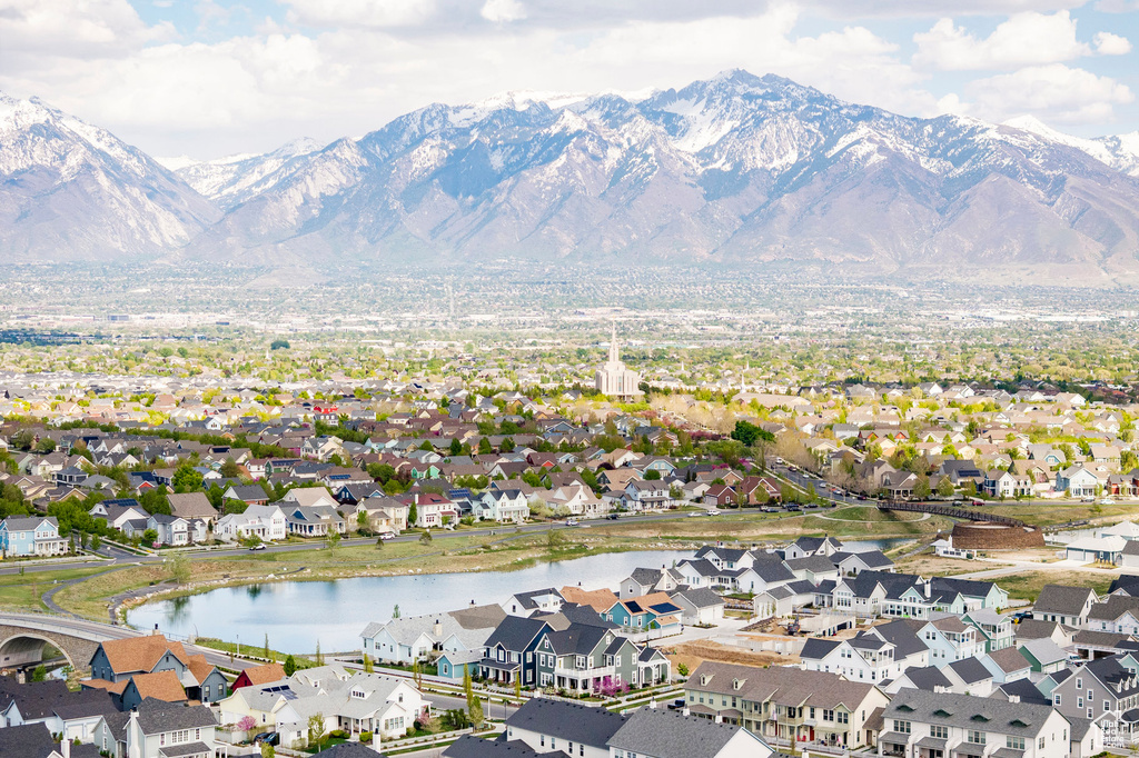 Aerial perspective of suburban area featuring a water and mountain view