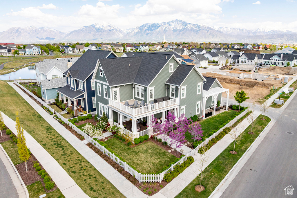 Aerial perspective of suburban area featuring a mountainous background