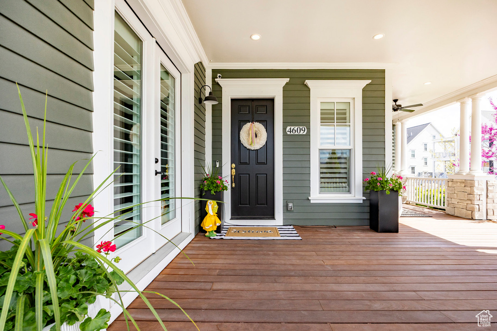 Entrance to property with covered porch and french doors