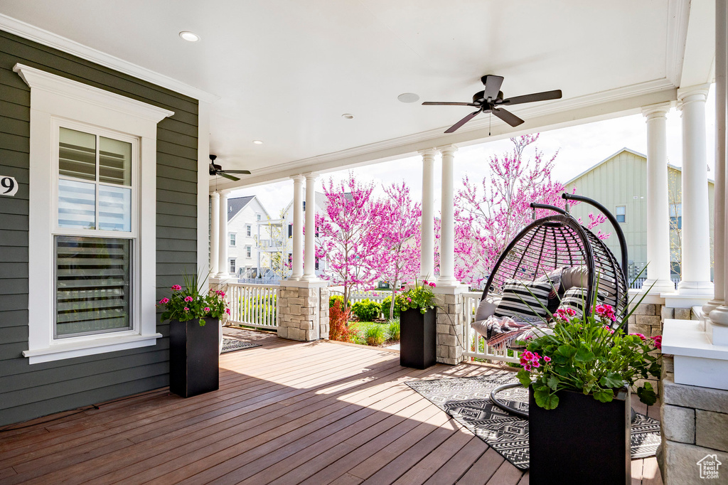 Deck featuring covered porch and ceiling fan