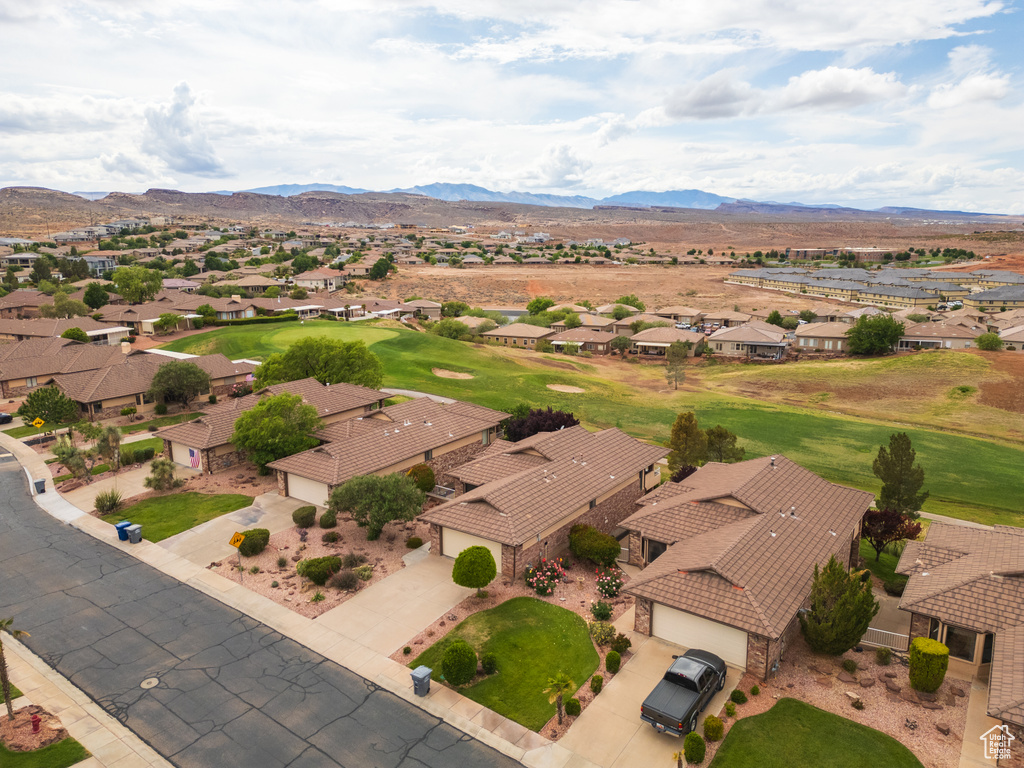 Aerial perspective of suburban area featuring a mountainous background