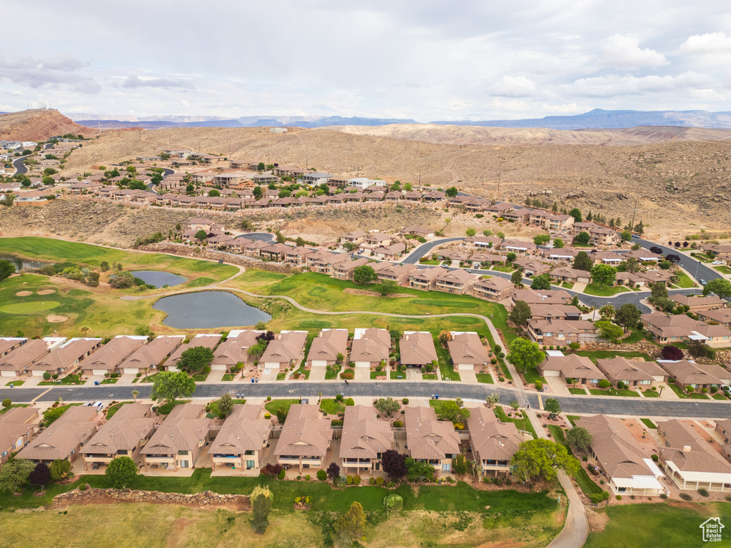 View of property location with nearby suburban area and a water and mountain view