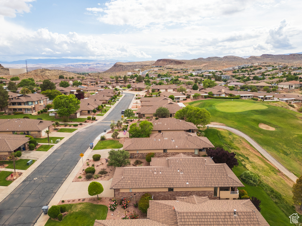 Aerial perspective of suburban area with a mountainous background