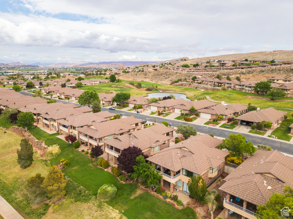 Aerial perspective of suburban area with a mountainous background