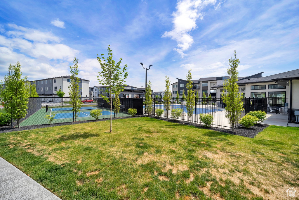 View of property\\\\\\\'s community featuring a residential view and a tennis court
