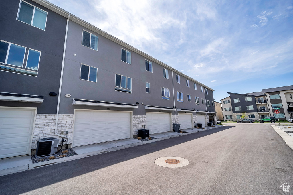 View of asphalt road with a residential view