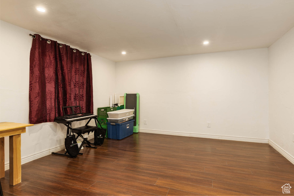 Misc room featuring wood finished floors, baseboards, and recessed lighting