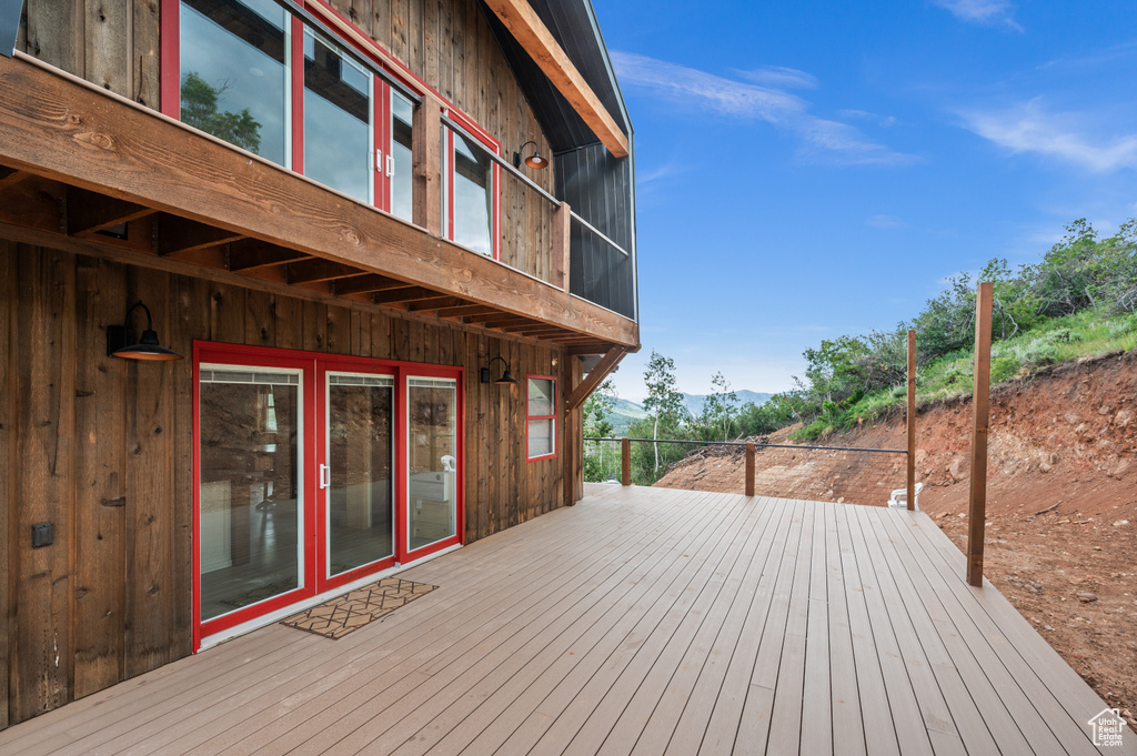 Wooden terrace featuring a mountain view