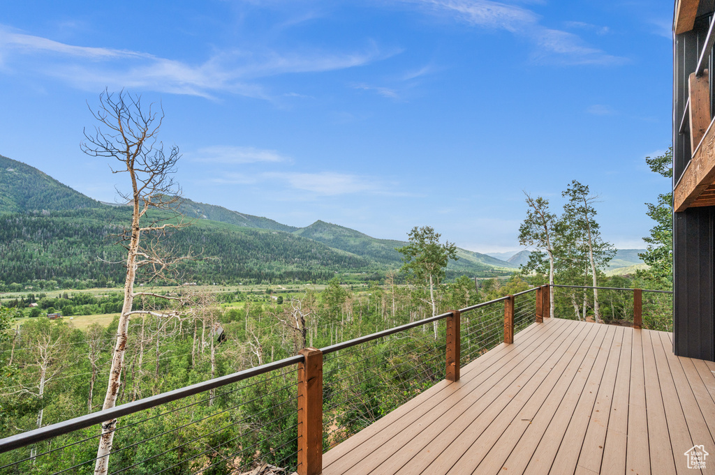 Wooden deck featuring a mountain view