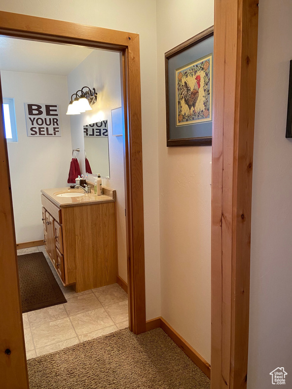 Bathroom featuring vanity and baseboards