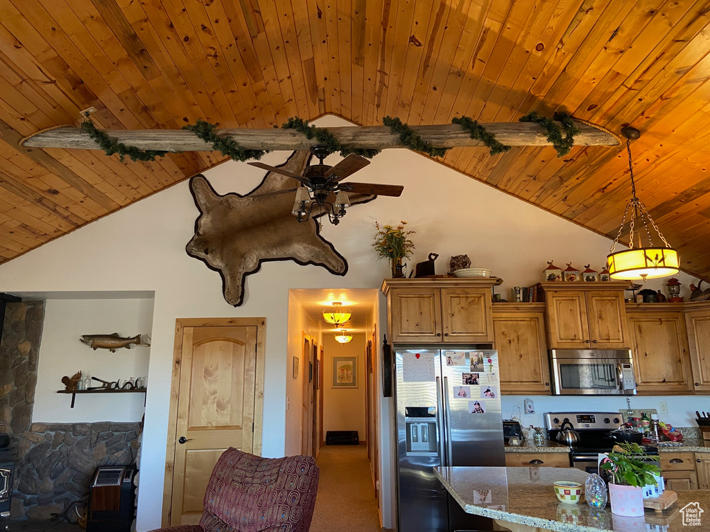 Kitchen with stainless steel appliances, wood ceiling, high vaulted ceiling, a ceiling fan, and pendant lighting