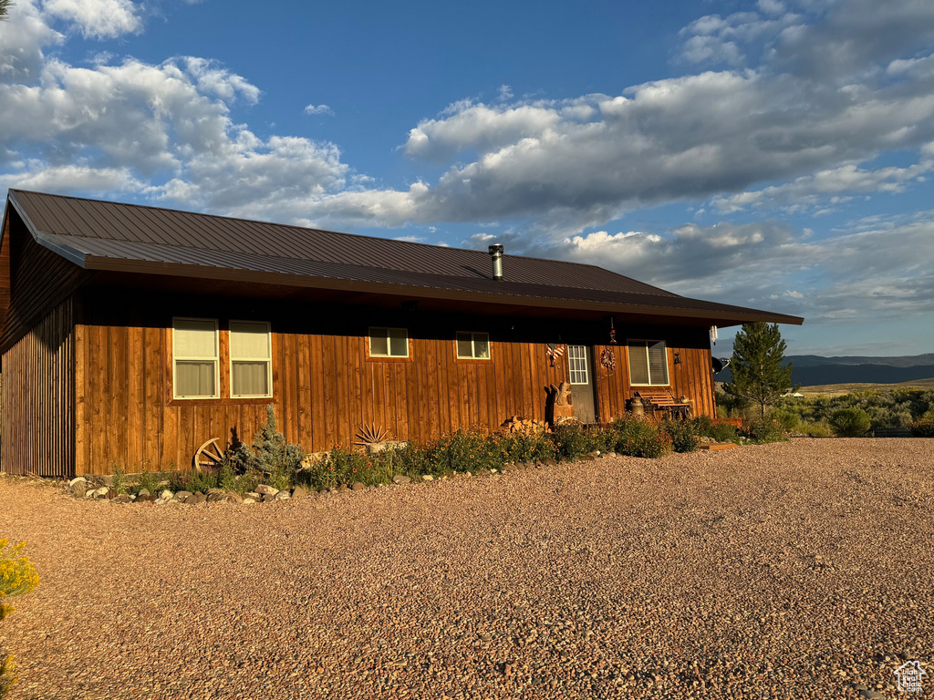 View of front of home featuring metal roof