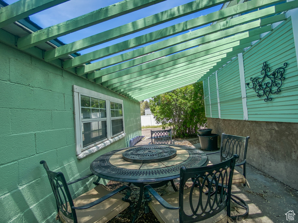 View of patio / terrace featuring outdoor dining area and a pergola