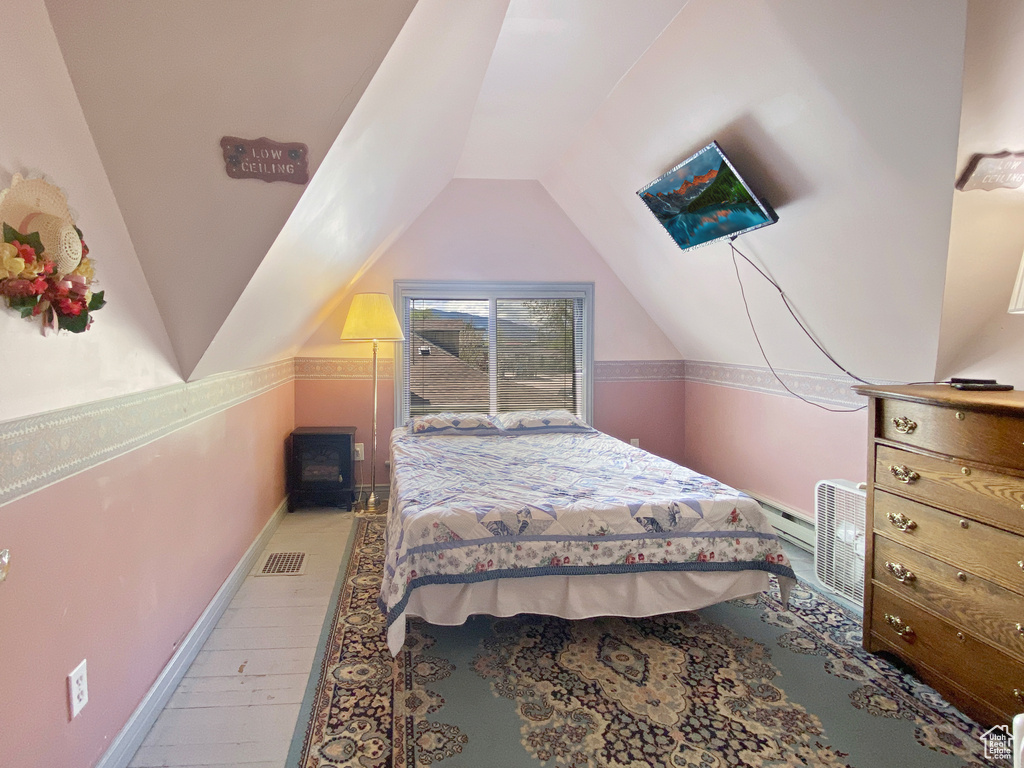 Bedroom with vaulted ceiling