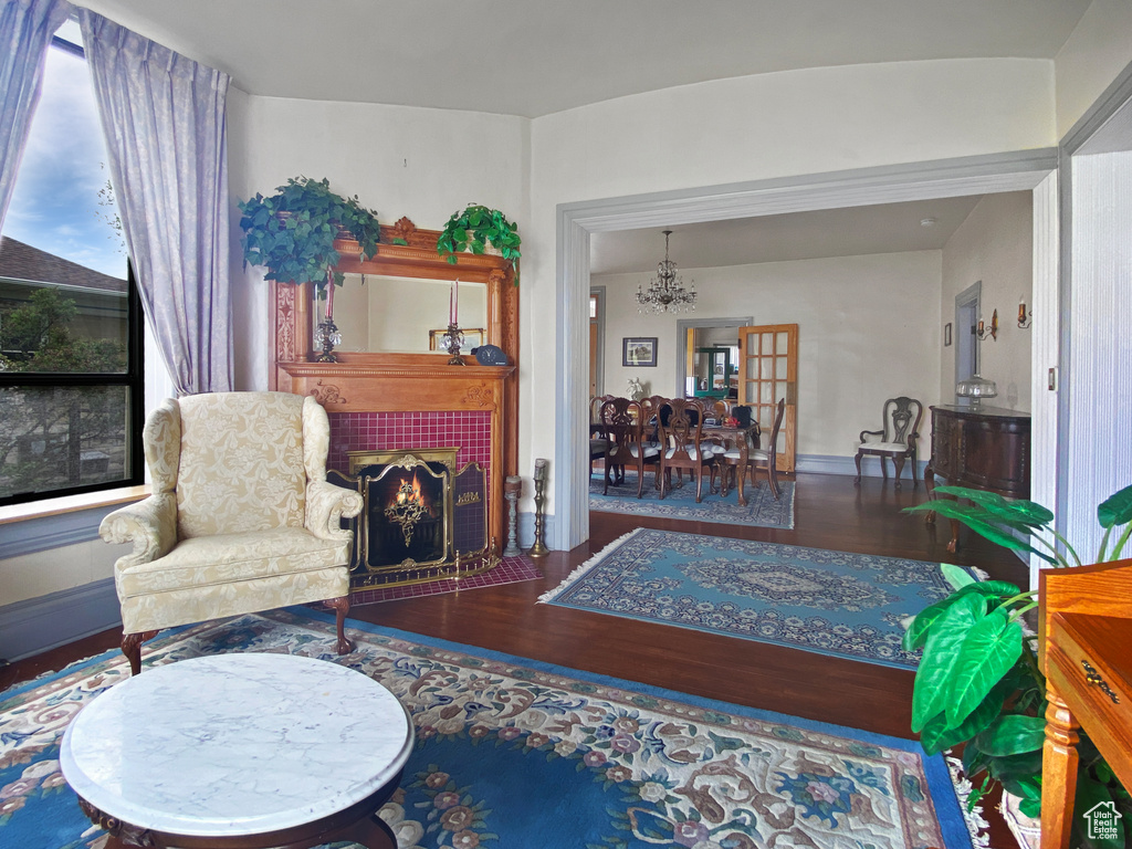 Living room featuring a chandelier and wood finished floors
