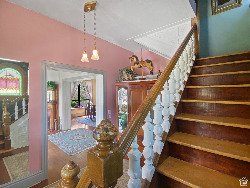 Staircase with lofted ceiling