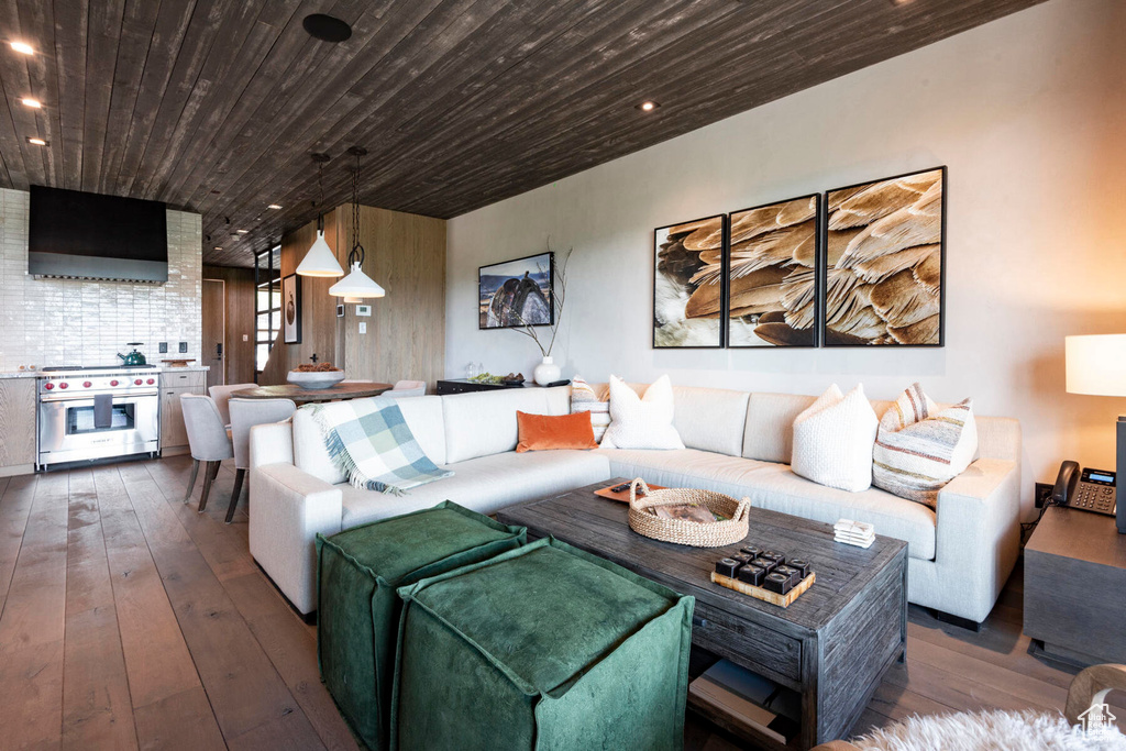 Living room with hardwood / wood-style flooring, wooden ceiling, and recessed lighting