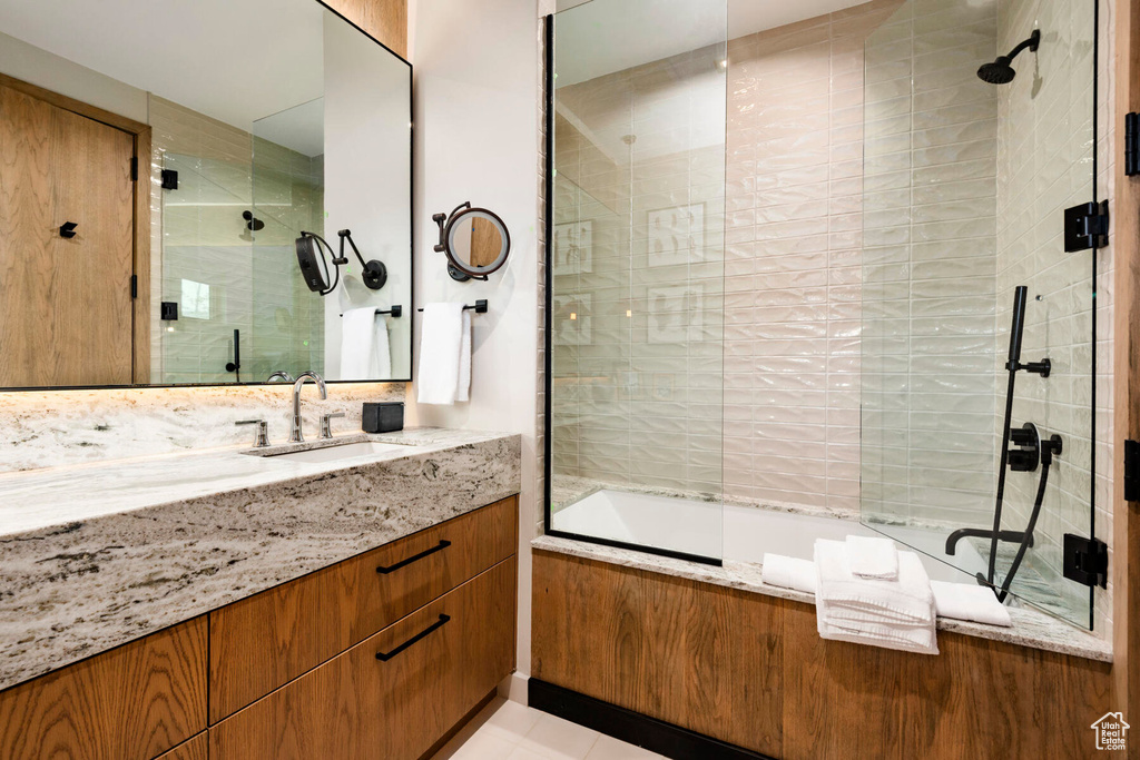 Full bathroom with vanity and tiled shower / bath combo