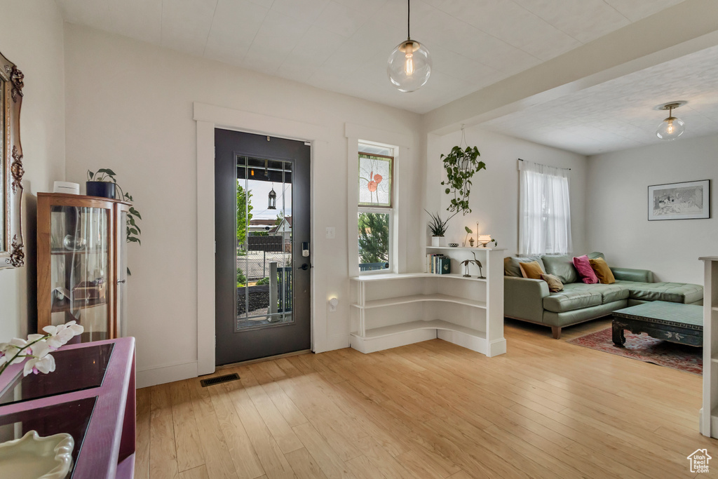 Entrance foyer featuring light wood finished floors