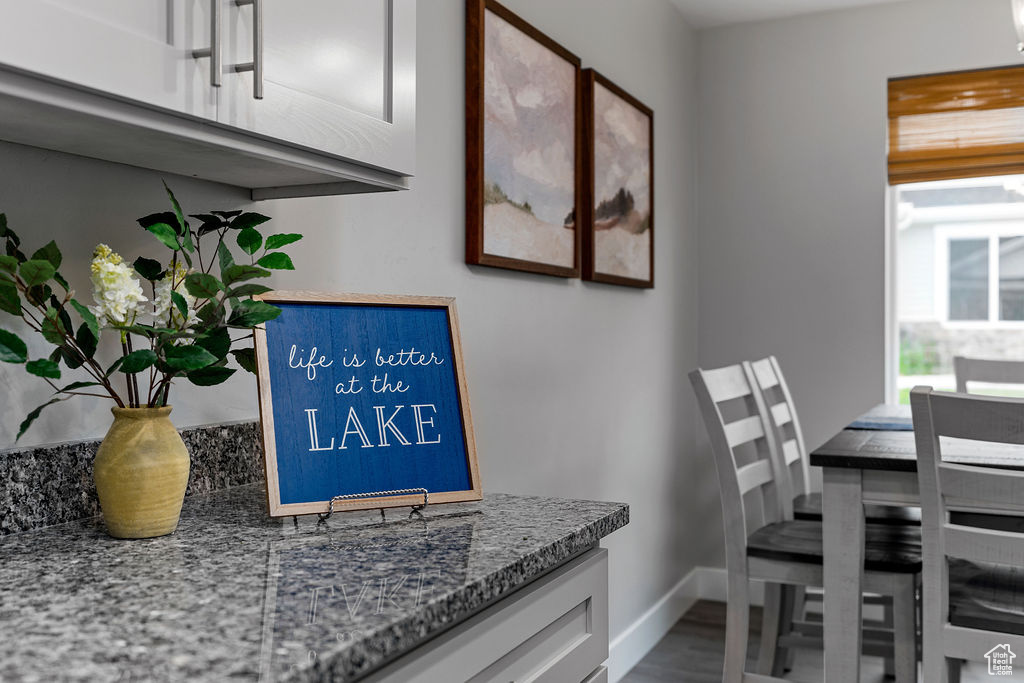 Dining space featuring baseboards and wood finished floors