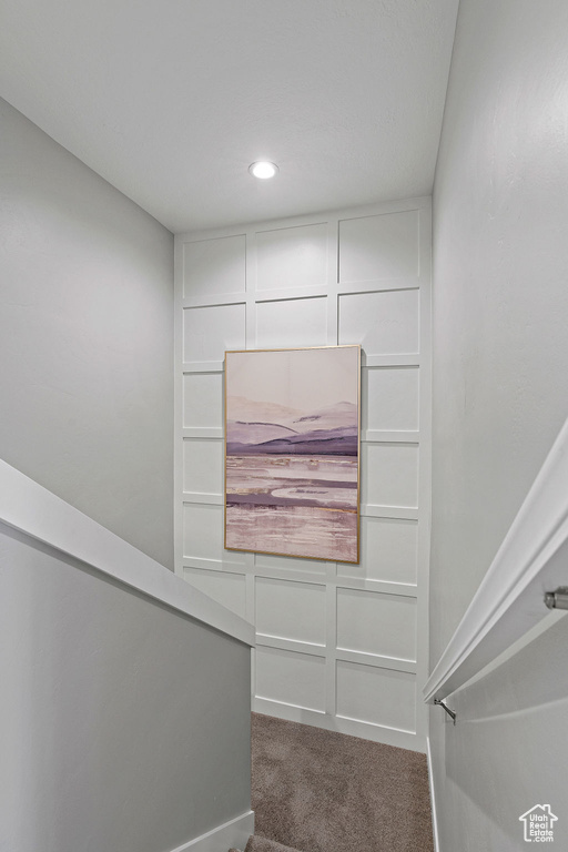 Stairs featuring carpet floors and recessed lighting