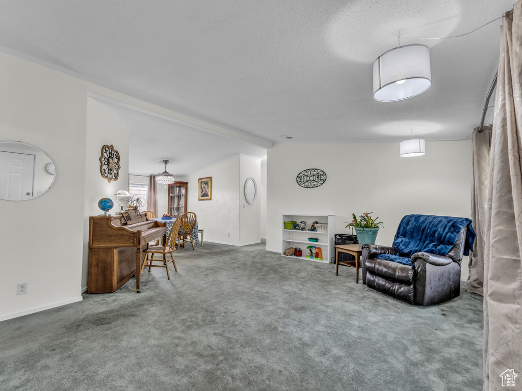 Living area with carpet floors and baseboards