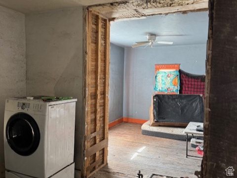 Clothes washing area featuring a textured ceiling, laundry area, washer / dryer, and ceiling fan
