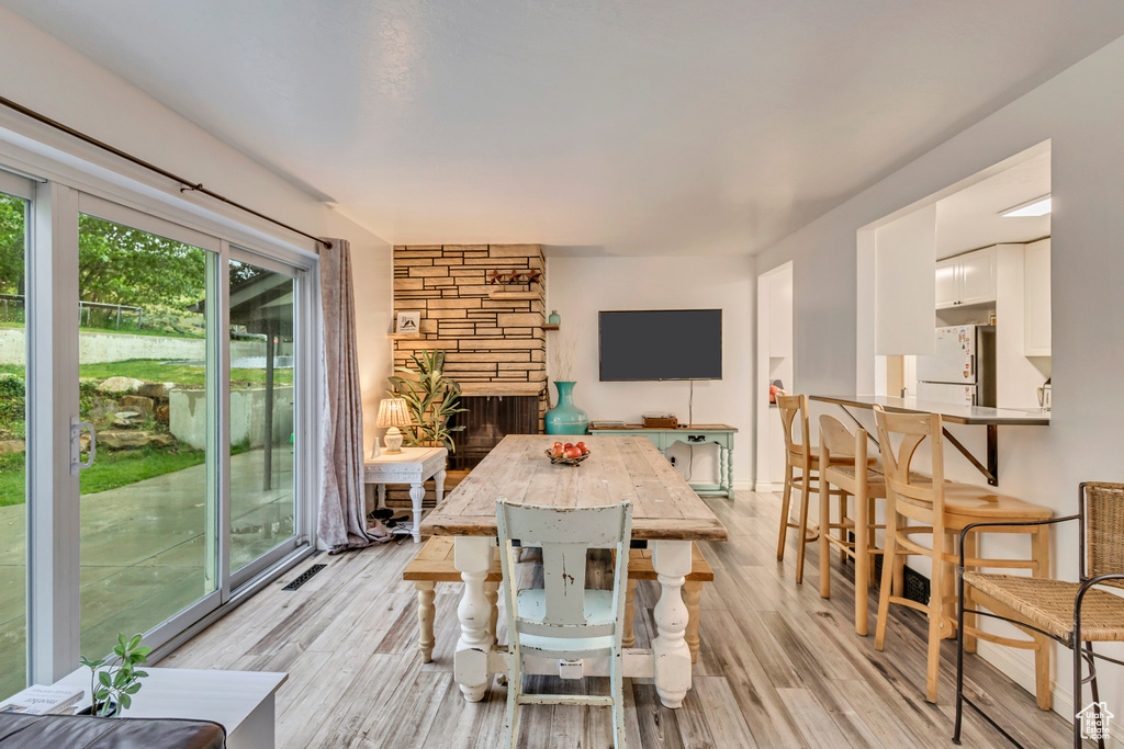 Dining space with light wood-type flooring